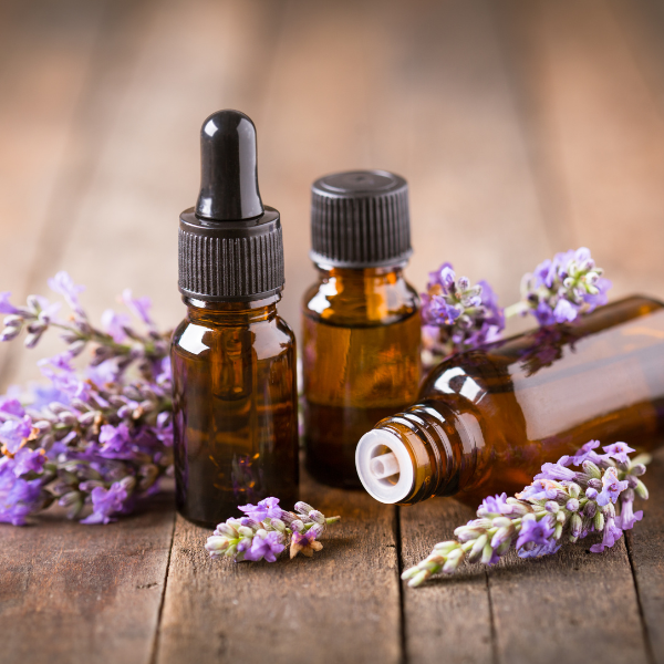 Aromatherapy bottles surrounded by lavender