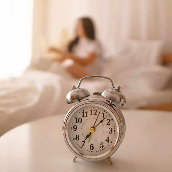An alarm clock in the bedroom, helping to wake up a woman in the morning 