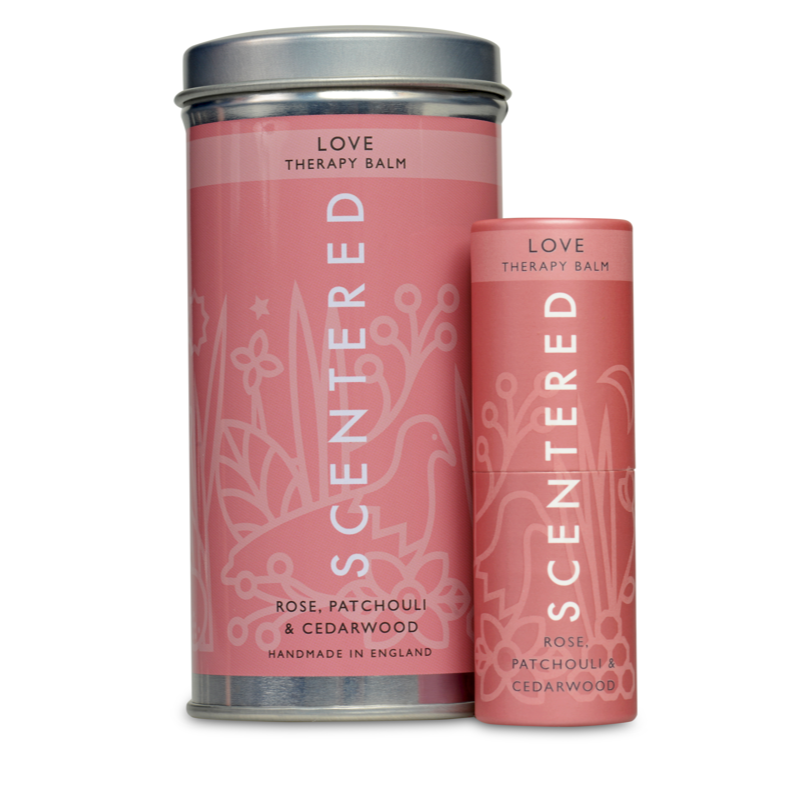 Scentered Love Aromatherapy Balm next to its reusable tin packaging, love Therapy Balm by Scentered, a romantic floral blend crafted to inspire feelings of love and emotional connection.